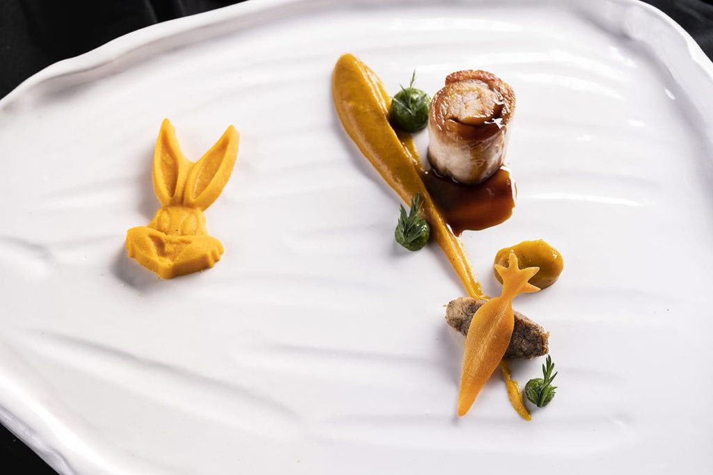 ischia lombo di coniglio stracotto di conigliocarota alla brace rucolino e fondo di carruba