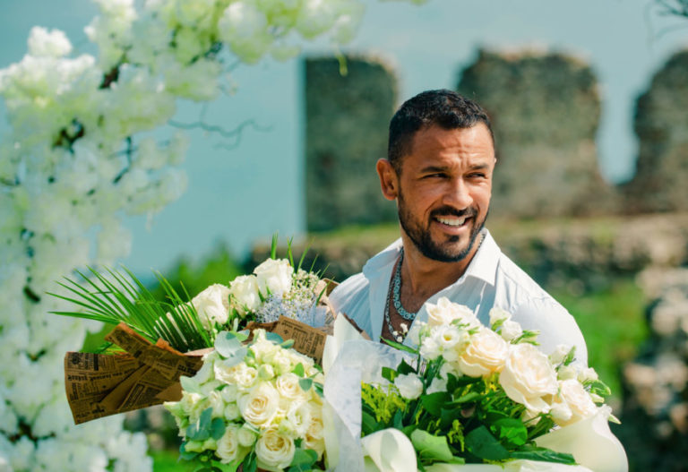 Guy smiling. Happy Groom. Attractive male model on party, comes to congratulate, celebrates festive event. Man with holiday attributes. Birthday, preparing to celebration.