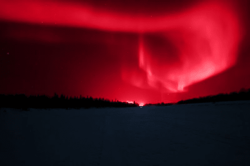 red aurora borealis in lapland m.png