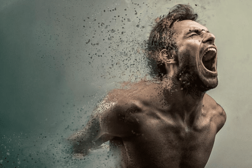 screaming man disintegrating into dust arms first on a grey and brown background m.png