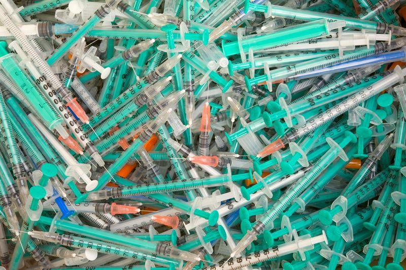 pile of disposable syringes m.jpg