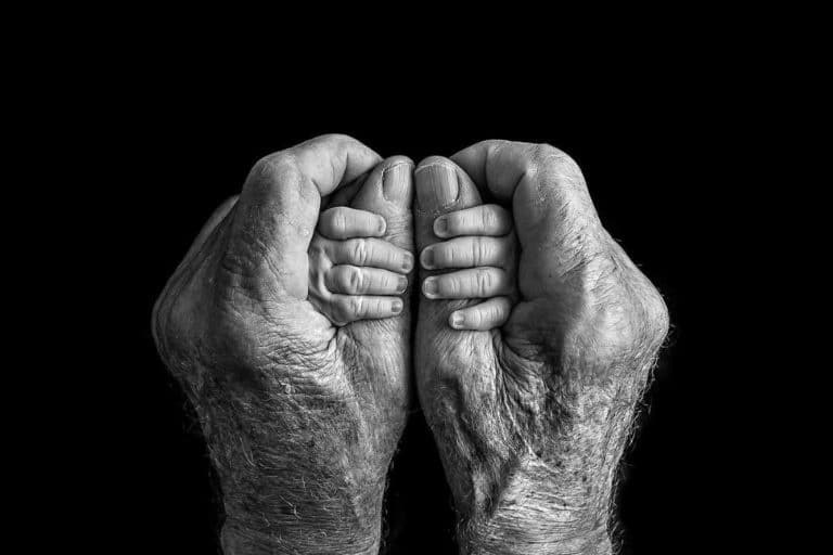In Great Grandpas hands by Yvonne C. Krystovsky.jpg