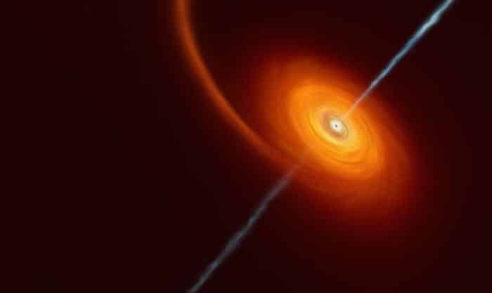 artist s impression of a black hole swallowing a star an orange spiral disc with a light blue beam of light emanating in both directions from the centre m.jpg