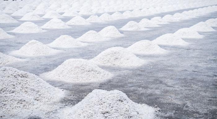 piles of white sea salt on a grey floor m.jpg