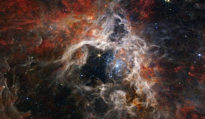 Il Bosone di Higgs e i Buchi Neri Primordiali: Il Pericolo dell’Universo in Bilico 1 tarantula nebula a starforming region seen by the james webb space telescope m 1.jpg