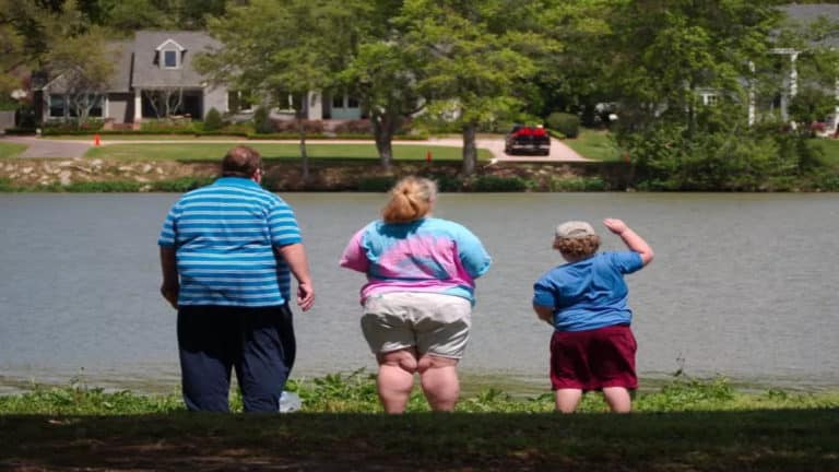 overweight family standing lake 1.jpg