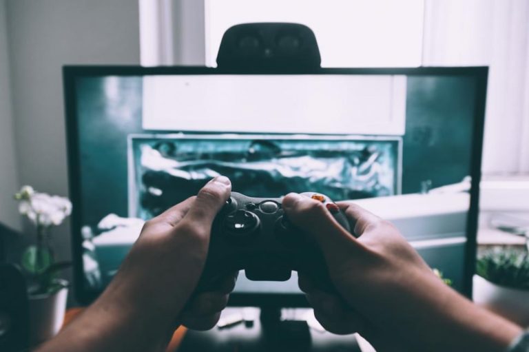 person playing video game in front of tv.jpg