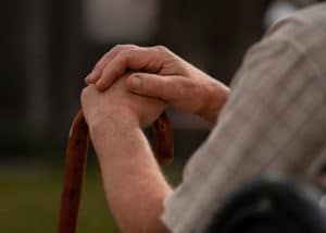 side view old man sitting bench