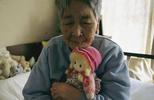 woman cuddling cloth doll.jpg